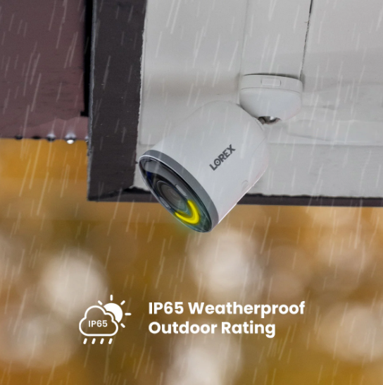 Outdoor security camera mounted under roof eaves, operating in heavy rain, showcasing IP65 weatherproof rating.