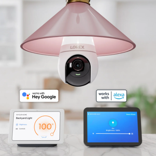 Lorex 2K Wireless Camera installed in a ceiling fixture, shown with Google Assistant and Alexa compatibility for smart home voice control.